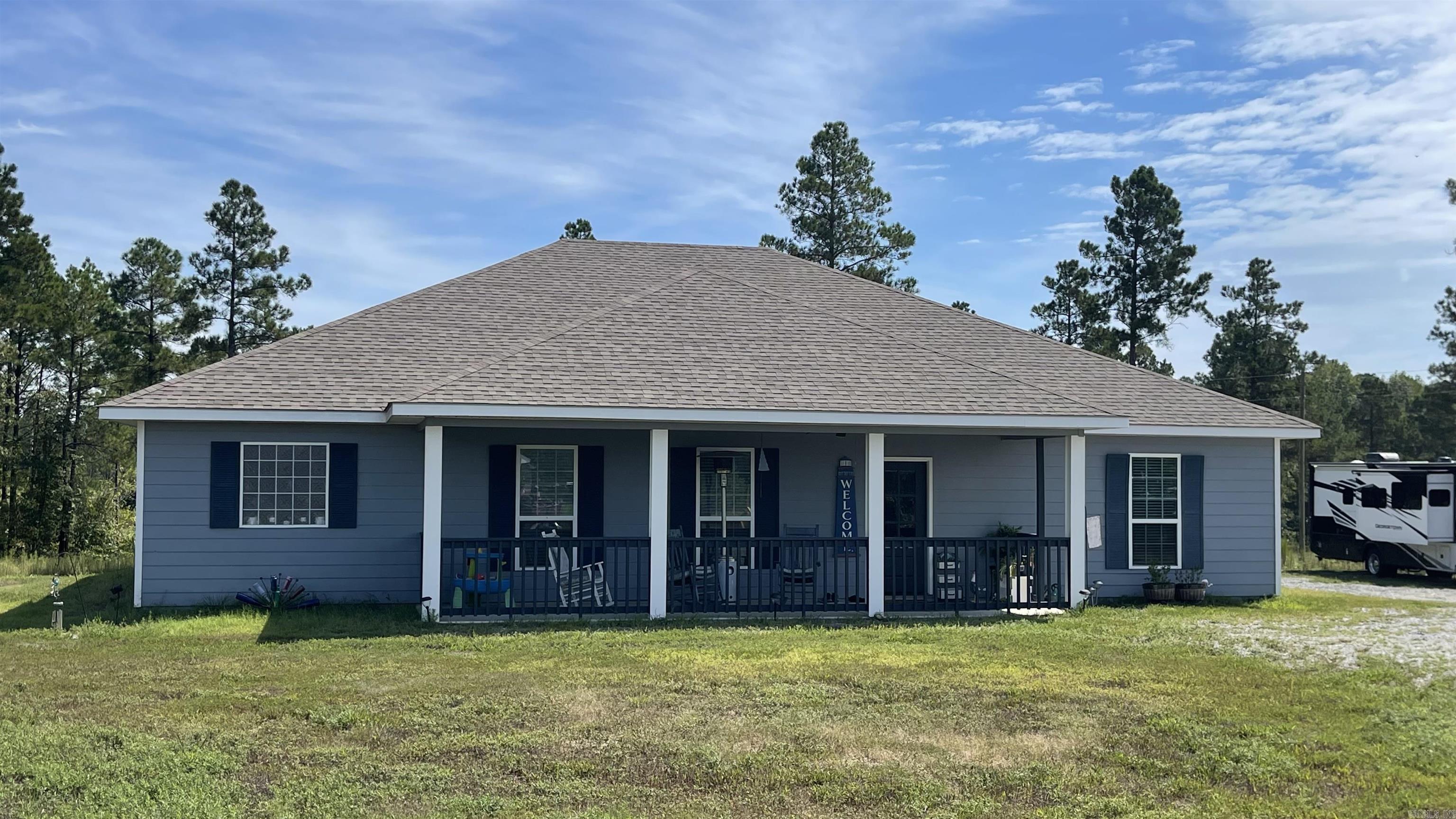 Rare newer generational home on 1.7 acres in Bauxite! This 3 bedroom, 2 bath property offers 2 kitchens and 2 separate entrances--perfect for in-laws or multi-family living. Upgrades include granite countertops, oversized pantry, soft-close cabinets, LPV flooring, and 2x6 exterior walls with R-38 insulation for comfort and lower utility bills. The home features the open kitchen/dining/living area. Master BR has carpet and 2 walk-in closets and a fantastic bathroom--granite counters, deep tub, large walk-in shower, and block glass window. The second BR has its own kitchen with refrigerator, stove and dishwasher and has been made into a living area for Mom. It has a door which leads to a screened-in porch. The third BR bath has two entrances - one from bedroom and one from hallway. The laundry area has lots of storage. In addition, there is an oversized garage, 9' ceilings, covered screened-in patio, 8x30 front porch, and separate RV connection. The 2 refrigerators and washer and dryer convey "as is." Enjoy the privacy of country living with room for toys or a shop, all while being minutes from Benton, Bryant, Little Rock, and Hot Springs. Don't miss this unique opportunity!