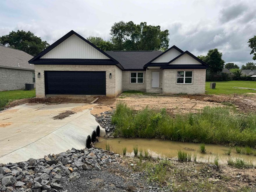 Affordable New Construction. Rural Development $0 down loan approved. All custom cabinetry and trim throughout. Luxury vinyl flooring throughout. No carpet. Bathrooms are custom tile. All counter tops are quartz. Updated lighting finishes throughout. Master suite has 2 walk in closets. House sits on a massive lot. All remaining construction due to be complete in 30 days.