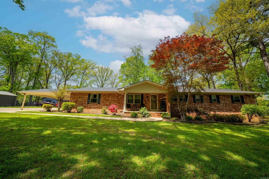 Step into charm, space, & versatility with this move-in ready 3 bed 2.5 half bath brick home offering approx 3340 sq ft of beautifully designed living space. You will appreciate the warm oak flooring in main living area complemented with a cozy brick fireplace & gas logs. The updated kitchen is true standout, featuring sleek quartz countertops, stainless steel appliances, & ample workspace. A separate dining area adds a touch of elegance for hosting while the laundry room has its own sink, extensive counter space, & storage. The home offers multiple living paces including a large sun filled living area with beautiful brick floors.  Both guest bedrooms feature dual closets while the spacious master boast three closets- including a massive walk-in closet & a flexible sitting area or home office. The bathrooms have been thoughtfully updated with spa like showers. A unique feature is the expansive bonus room complete with its own kitchen/bar area and the 1/2 bath perfect for game room, man cave, or hobby space. The value doesn't stop there, property also includes a 1 bed 1 bath apartment with full kitchen & living area- ideal for rental income or multigenerational living.