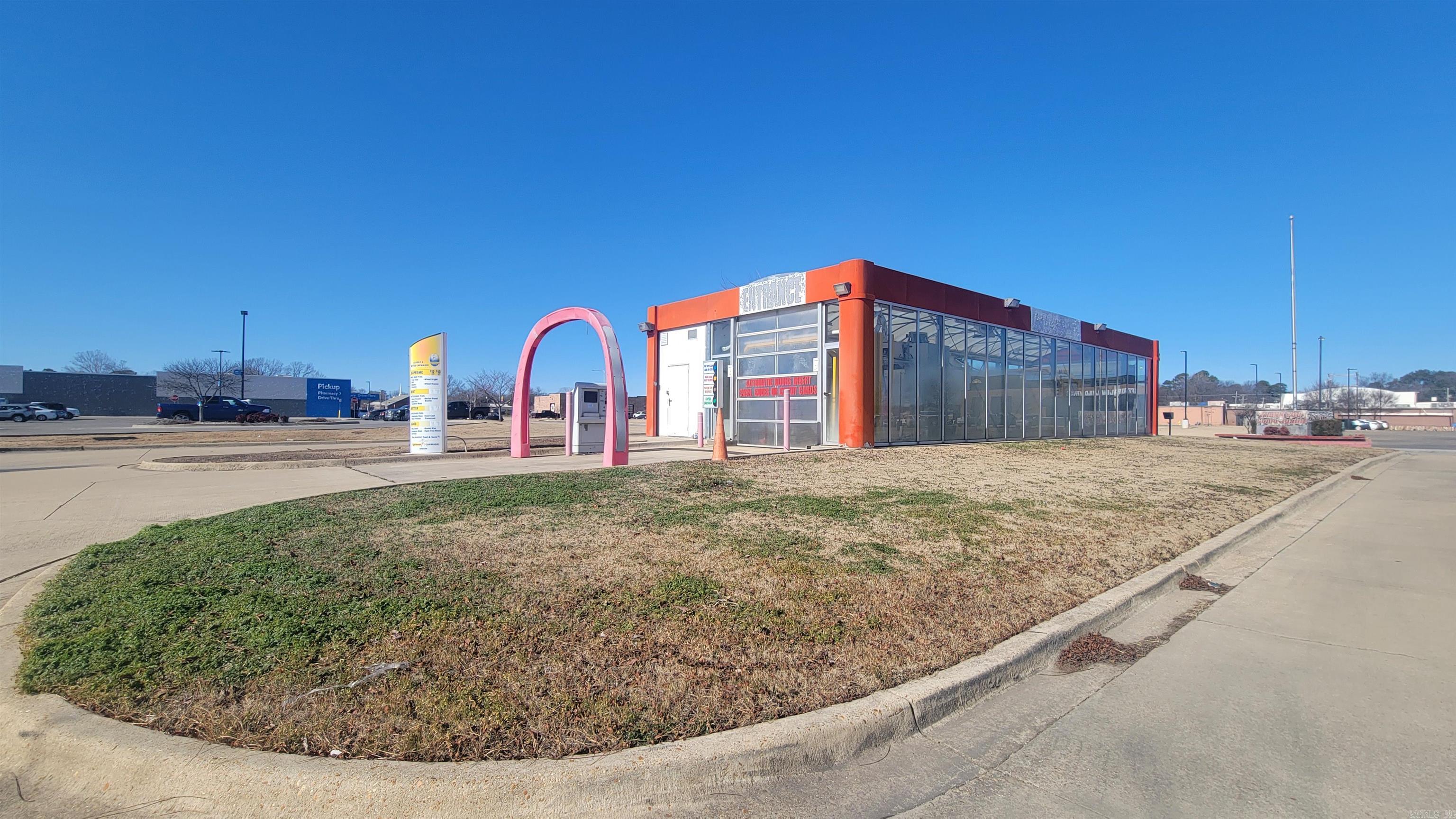 Carwash off Red Wolf Blvd. next to Walmart Neighborhood Market on Creek Drive. Development possibilities available on this half acre lot.