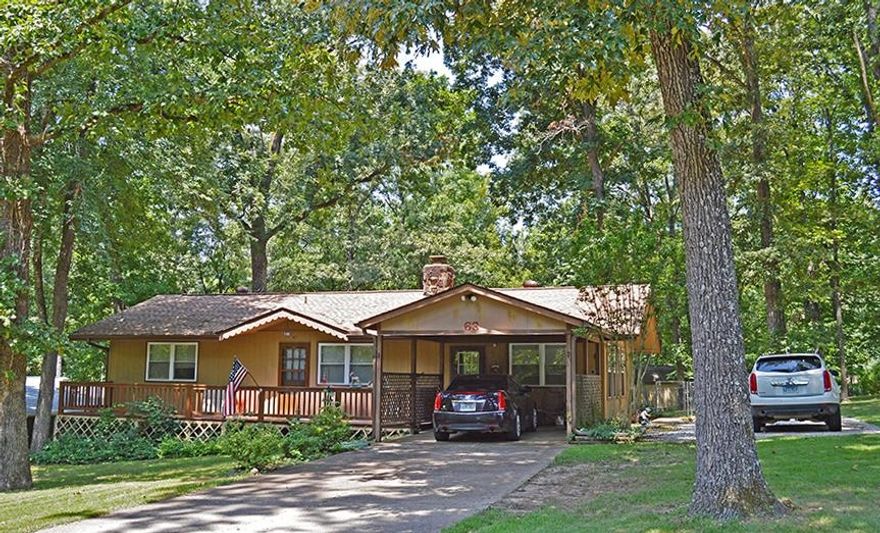 Across Street from C. V. North Golf Course - Looks like a Park! Very neat 2 bedroom, 1 & 1/2 bath home has many special features.  Central heat/air, large front deck, smaller private deck around back, 2 storage buildings and fenced back yard. There is a bonus room which could be a 3rd bedroom or office, a covered carport, 2 extra gravel parking areas and 2 lots takes the lawn all the way to the corner.  The yard is level and landscaped. New architectural roof shingles installed 2023. Shown by appointment.