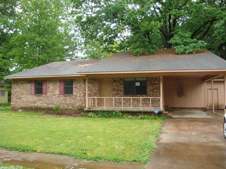 Lots of room in one of the largest houses in town, with an attached shop and three living areas.  Laminate floors and carpeting throughout. French doors to the back yard. See Agent Remarks.