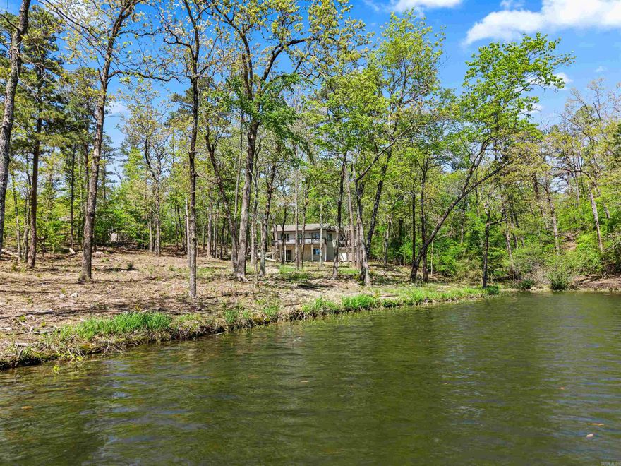 Wow! Lake Coronado WATERFRONT under $400k! This REMODELED home sits on a huge 1.24 Acre Lot with approximately 251' of Shoreline! NEW Roof and nearly everything under it.... Full Kitchen Remodel, New LVP floors, Fresh Paint, all 3 Bathrooms, Windows & Slider to rear and more! Enjoy the View from the upper Deck or lower Patio! Living Room boasts a Cathedral Ceiling and Gas Fireplace! Square footage doesn't include a finished Storage Room with access from the rear of the home! Adjacent Walk-in Shed for tools or gardening supplies! (Primary Bedroom with Ensuite upstairs, hall 1/2 Bath and an additional Bedroom/Den off the Living Room + Laundry/Pantry off Kitchen. Downstairs is bedroom 3 and a rec room with Full Bath). Don't miss this golden opportunity to be on the 2nd largest lake in 26,000 gated acre Hot Springs Village... 380 acre Lake Coronado (full recreational lake - water skiing but no jet skis). Would make a great home or nightly rental!