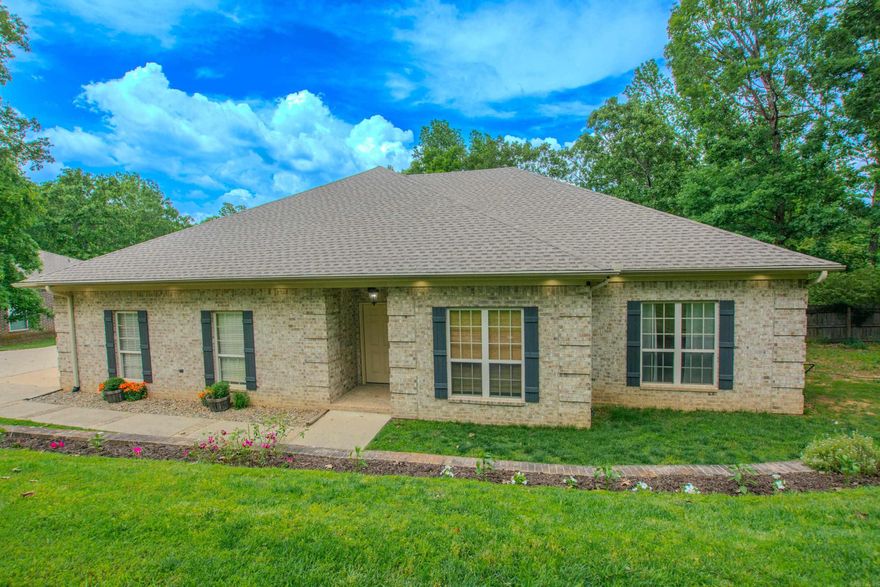 Start your day with a cup of coffee on the covered deck, overlooking a serene lake and spacious backyard. This beautiful 4-bedroom, 2-bath home features a generous layout with a large den and a dining/flex area—both offering stunning views of the water and backyard. The eat-in kitchen boasts new granite countertops, under-cabinet lighting, and plenty of cabinet space for all your storage needs. The split-bedroom floor plan ensures privacy, while the side-load garage and additional parking pad provide extra convenience. Outside, you'll find a cozy fire pit, perfect for entertaining or relaxing in the evening. Nestled at the end of a quiet 4-home cul-de-sac, this home offers the perfect blend of peace, privacy, and picturesque views.