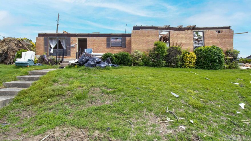 Home was hit by the tornado. Sold as is. Will need to be cleared. May can use existing slab.