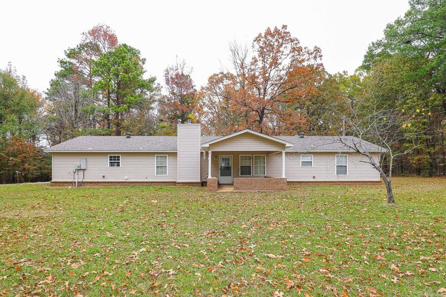 City Convenience with Country Charm... Amenities Include: Approximately 1692 Square Feet, 3 Bedrooms, 2 1/2 Bathrooms, Kitchen/Dining Combo, Living/Dining Combo, Breakfast Bar, Great Room with Wood Burning Fireplace, Formal Living Room, Large Laundry Room with extra Storage and Toilet, Sitting Front Porch, Covered Rear Patio, Nice level .50 / half acre +/-, 2 Car Side Load Garage, Benton Schools, And Much More... All Close and Convenient to all Area Shopping, Dining, Schools, Churches, and Interstate 30.