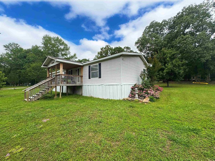 Welcome to 112 Ashley Place! PROPERTY MEETS FOUNDATION REQUIREMENTS FOR FHA/VA LOANS! This 3 bedroom 2 bathroom manufactured home sits on 2 lots equaling almost an acre of land just outside of Searcy! LVP Flooring throughout- NO CARPET HERE! The well laid out kitchen offers plenty of storage and the open concept is perfect for entertaining. The split floor plan provides privacy and maximizes space. You'll love the covered back deck for grilling and the covered front porch for sitting! 2 nice storage buildings connected by a lean to give you plenty of hobby or storage space and even a covered place to park your boat or toys! Don't miss out on this conveniently located home with a country feel!