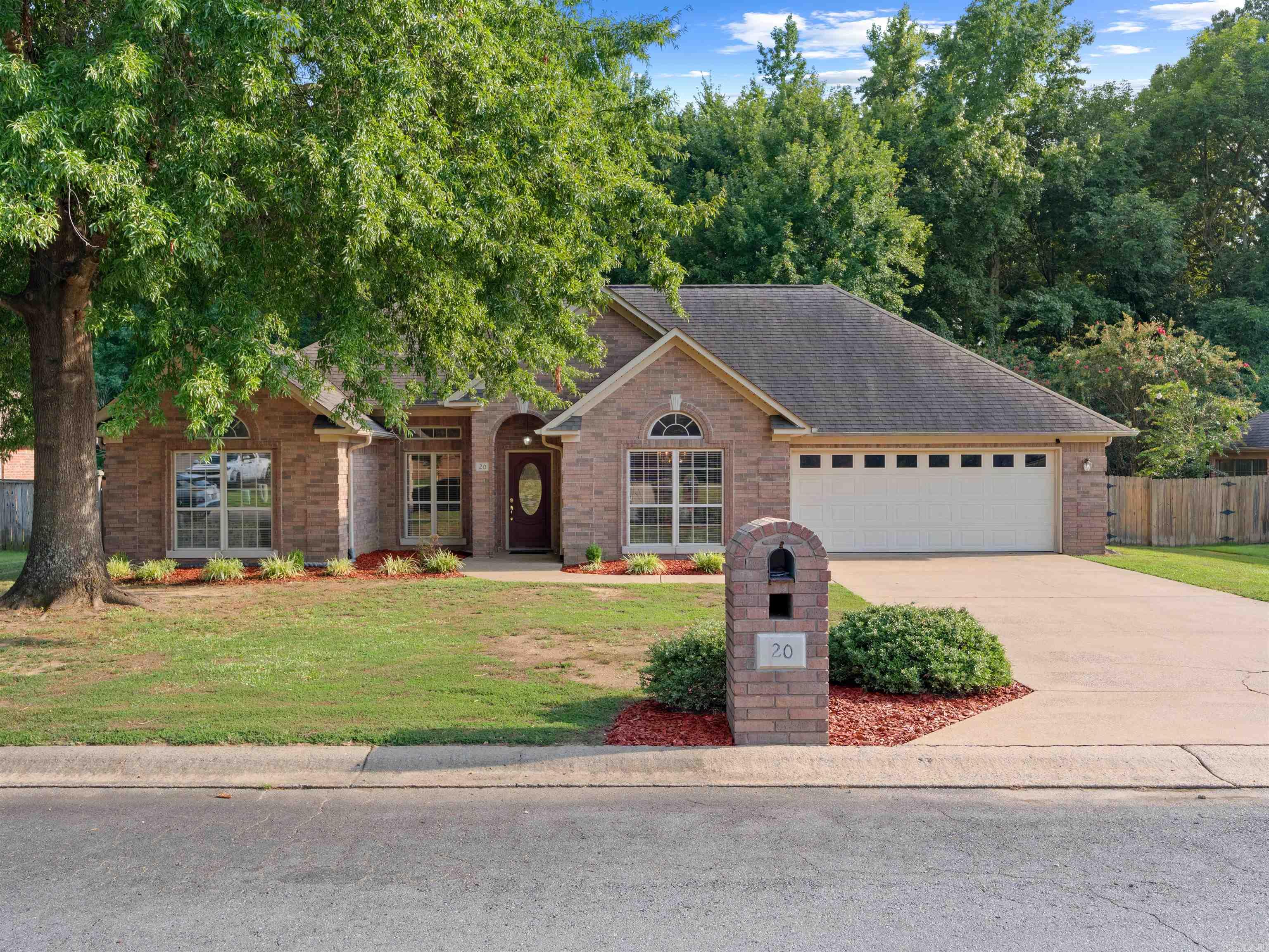 This stunning all-brick 3-bedroom, 2-bath home blends elegance and comfort on a quiet street with cul-de-sacs at both ends. The split floor plan opens to a welcoming entry with hardwood floors leading to a spacious living room with 12-foot ceilings, detailed moulding, and a gas fireplace with a cream marble-look surround. The kitchen is a chef's dream with granite countertops, ample cabinets, pantry and ceramic tile flooring, flowing seamlessly into a breakfast area. The dining room shines with hardwood, custom molding, and an oversized window. Retreat to the luxurious master suite with whirlpool tub, separate shower, and an extra-large walk-in closet. Enjoy privacy in the fenced backyard backing to woods and green space, plus bonus features including carpeted bedrooms, storm shelter, and a 12x16 electric shed included.