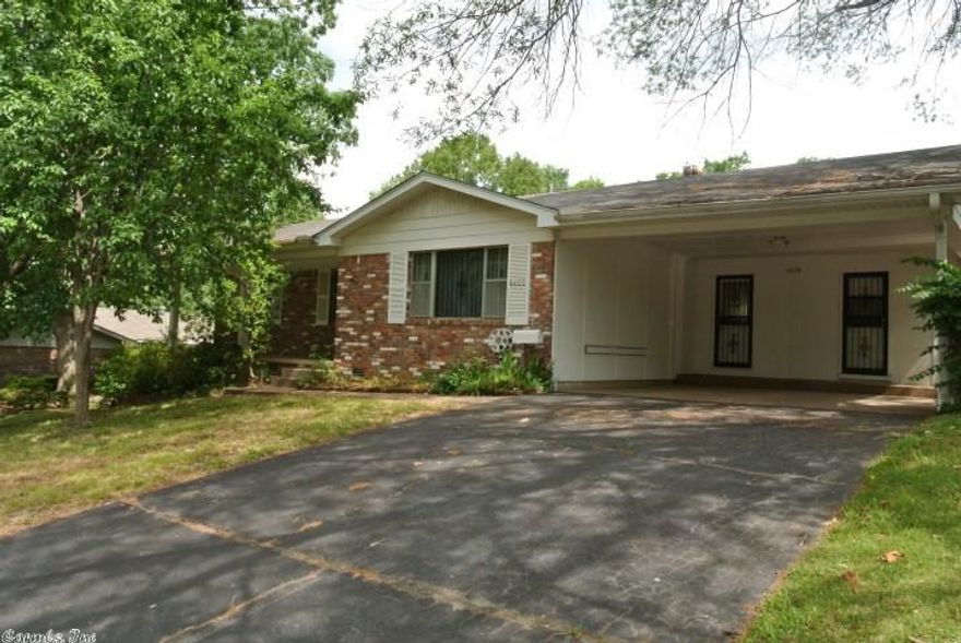 Fabulous one level in great location which is close to shopping, hospitals....just about everything!  Large living area that has great space for dining.  Nice sized bedrooms.  Kitchen has updated appliances.  Newer flooring throughout most of home.  Large laundry room which has great storage.  Lovely backyard with garden area, stamped concrete patio and deck area.  Bonus of an insulated storage building with electricity and window a/c unit.  Great for potential workshop area.