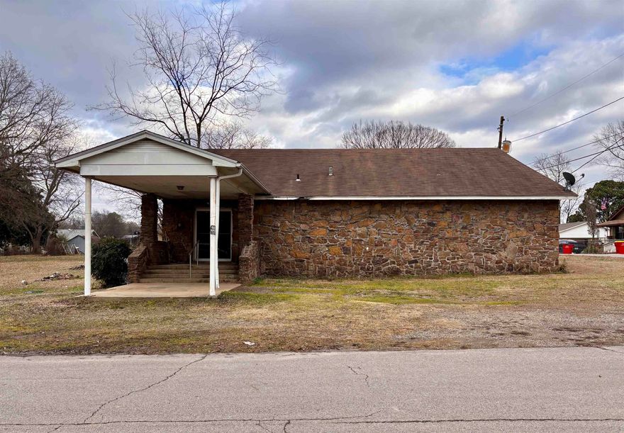 Great investment property in need of some TLC! Zoned R-2 for a residential home or a duplex. Currently has 4 bedrooms and a bonus room and 1 1/2 baths. Corner lot and sits on approximately .56 of an acre. Central heat/air and water heater are approximately 10 years old and wiring updated in 2014. Selling AS-IS.  Seller will not make any repairs.