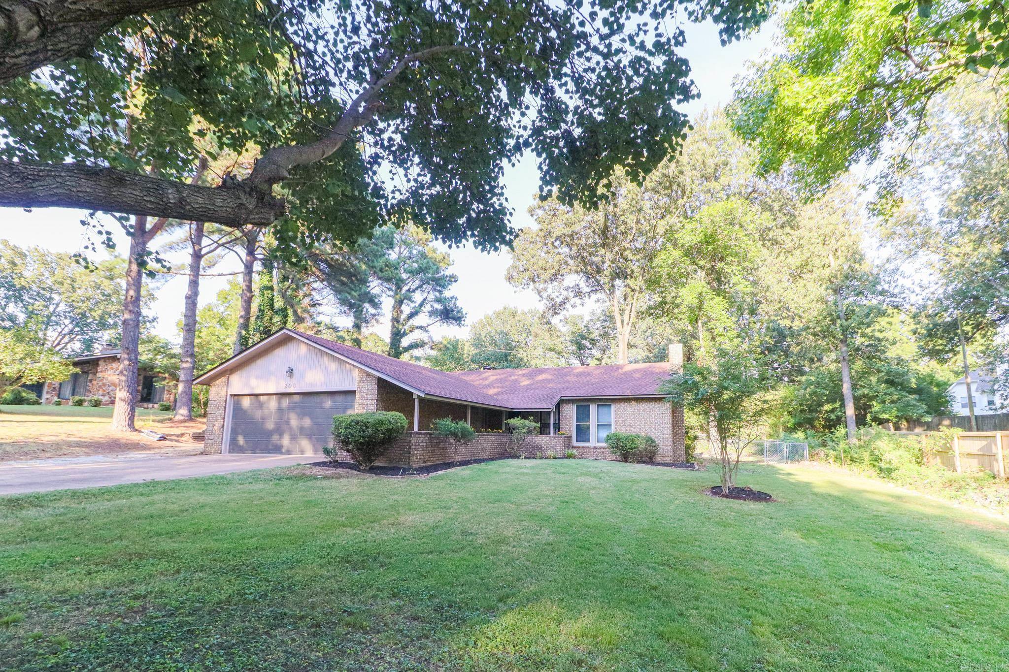 All-Brick Home with Large Shop in a Great Established Neighborhood Welcome to 208 Cater Dr. in Jonesboro an exceptionally well-maintained 3-bedroom, 2-bath brick home located in a great established neighborhood just off Aggie Road. Surrounded by beautiful shade trees and attractive homes, this property offers both charm and convenience near Arkansas State University, University Heights Elementary, and the vibrant Hilltop area. One of the home's most unique features is the large shop building, approximately 24x32 (more or less), complete with an overhead door perfect for hobbies, storage, or workspace needs. Additional highlights include a new roof installed in 2024, a gas fireplace, fenced backyard, nice deck, and a double garage. All kitchen appliances convey with the home, making it move-in ready. This is a rare opportunity to own a quality home with a shop in a quiet neighborhood that is convenient to so much that Jonesboro offers. Don't miss your chance schedule your private showing today!