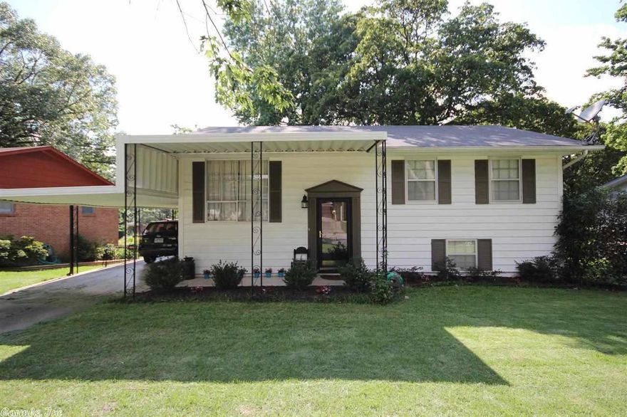 This home has it all! Large level lot, huge backyard for the kids to run and play, a man cave for dad & large workout/craft room for mom! Kitchen is open to dining/living area. Original hardwoods under the carpet. Decorative ceiling molding & beautiful ironwork accent the upstairs living area. Low maintenance metal siding, gutters and 2 tiered deck.  Newer appliances and new HVAC in 2012. Refrigerator, washer and dryer convey. Very well maintained and convenient to downtown LR, NLR and the LRAFB.  Must see!