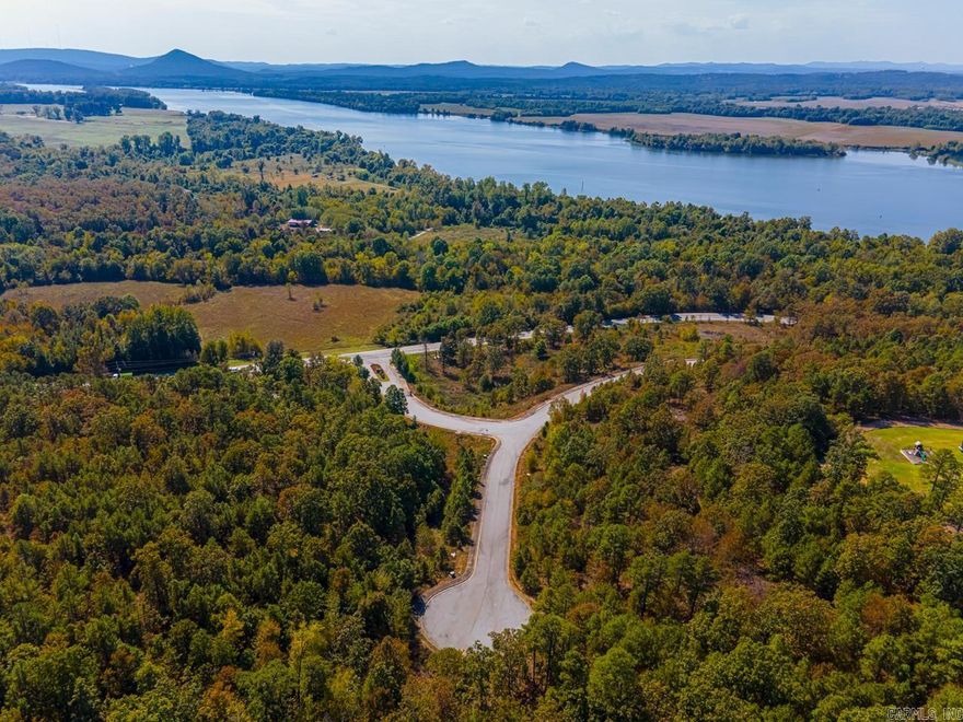 RIVER VIEW LOTS!! DREAM BIG!!! Because this just may be what you're dreaming of!! Two lots giving you more space and privacy with a River View and a view of Pinnacle Mt!  If you're working from home, I promise, you won't mind taking a break on your veranda, with a view of the Ar River, Pinnacle Mt, Chenal Towers and other Mountain Ranges! Minimum sq ft to build is 2500 sq ft. and comes with all underground utilities, to include water, electricity, gas and sewer.   Also ATT Fiber High Speed internet! Enjoyable evenings with Mango Sunsets!! What's not to love! Minutes to Maumelle! Gates are open 2-4 on Saturday and Sunday. Come on out! You're always welcome!