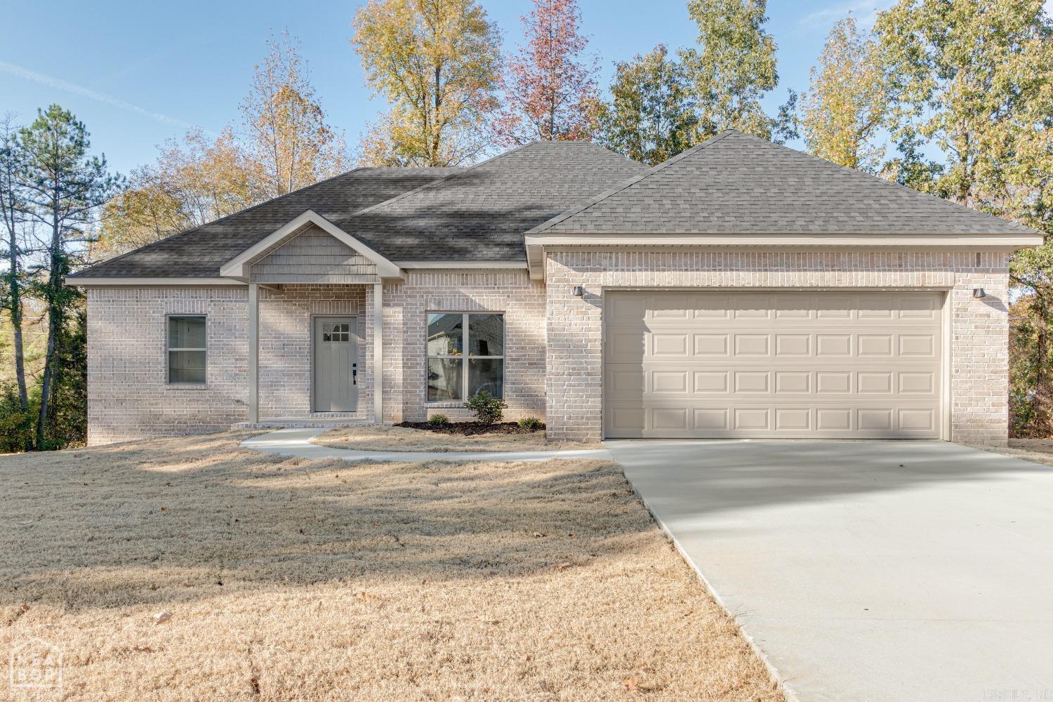 Introducing a stunning all-brick home for sale in a growing area offering the perfect combination of comfort, style, and location. This beautiful home is surrounded by shade trees that provide a serene and welcoming atmosphere at the end of a cul-de-sac. There's a seamless flow of the semi open floor-plan, 10ft ceilings, and Luxury VP flooring throughout. The dining room features large windows that flood the room with natural light, highlighting the quality craftsmanship and attention to detail. The kitchen has sleek granite countertops, ample custom cabinet space, and stainless steel appliances. There is also an eat in dining area off of the kitchen in addition to the dedicated dining room. The home has three bedrooms, including a master suite with a stand alone shower and soaker tub. With the split floor-plan you'll find the two additional bedrooms are on the opposite side of the home. Step outside onto the covered back porch and enjoy a peaceful time in your own backyard. This is a high-quality and energy-efficient home. Builder incentive up to $5,000 to use towards out of pocket expenses such as closing costs.
