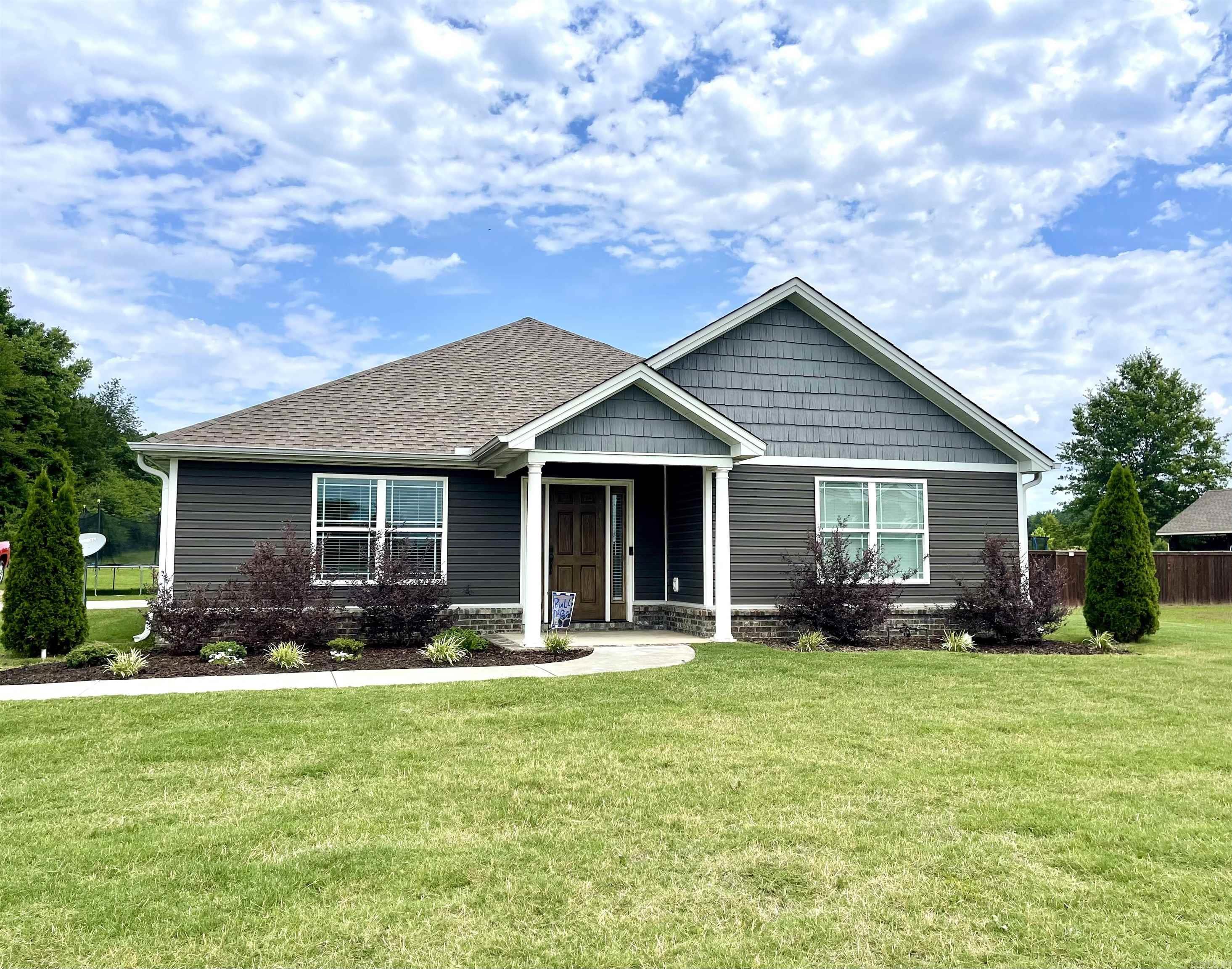 Discover your dream home in Bald Knob! This stunning, custom-built 1,850 sq ft home, nestled on a serene 1.4-acre lot, is the epitome of comfortable living. As you step through the front door, you'll be greeted by a spacious living room that seamlessly flows into the kitchen and dining area. The kitchen is a chef's dream, featuring granite countertops, custom lighting, and a garbage disposal. A breakfast bar offers additional seating, while a double-sided pantry provides ample storage. The master suite is a private retreat, complete with a large walk-in closet and a luxurious master bathroom boasting a custom-tiled walk-in shower. A spacious laundry room with a sink adds to the home's convenience. Outside, a 2-car garage with a pull-down attic door offers plenty of storage space. The expansive backyard is perfect for outdoor entertaining or building a workshop. Custom LED lighting illuminates the home's exterior, creating a warm and inviting ambiance. Located in a peaceful, sought-after neighborhood, this home is just a short golf cart ride away from the Bald Knob golf course. Don't miss this incredible opportunity! Schedule your private showing today. Agents, see remarks.