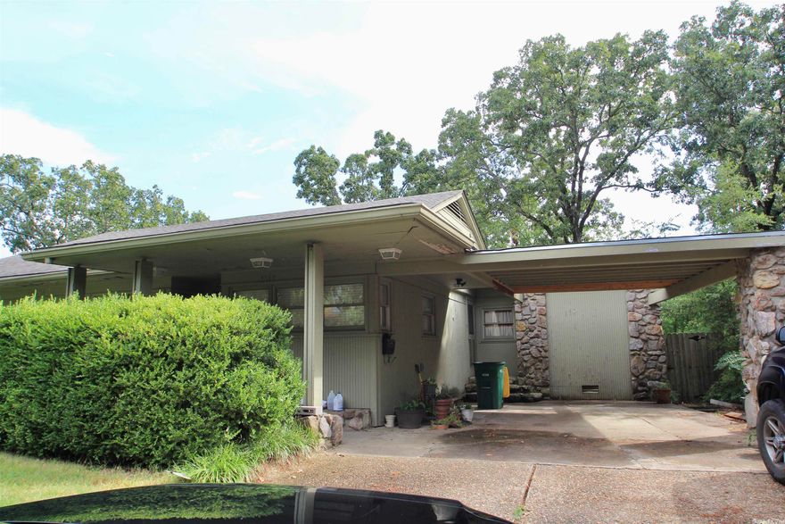 This spacious, mid-century modern home is waiting for a new owner to make it beautiful again.  Perfect for entertaining w/ open kitchen w/ wet bar, wine cooler, 2 pantries, & large living room.  4 beds/4 baths. Primary bedroom has split bathroom & closets.  Walk-out basement heated/cooled & provides perfect spot for workshop, craft room, or game room.  Roof 2 yrs old. New kitchen countertops, flooring & paint in great room.  Sold as-is.  (SEE AGENT REMARKS)