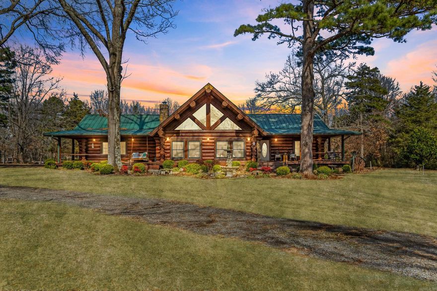 Stunning 3,118 sq ft custom log home on 9.62 beautiful acres, constructed from Engelmann Spruce grown in Canada and originally crafted in Colorado. The logs were carefully relocated and professionally assembled on site, offering timeless appeal and exceptional attention to detail.The main living area features vaulted ceilings, exposed log beams, natural wood finishes, and a massive stone fireplace plumbed for propane or wood burning. The home is also plumbed for propane gas and offers 3 bedrooms plus a spacious loft used as a 4th bedroom/office with  built-in closets, 2 full baths, and 1 half bath.The kitchen has been updated with granite countertops and new appliances and includes a storm shelter just off the kitchen for easy access and added safety. A wraparound porch spans approximately three-quarters of the home and overlooks a private pond and peaceful acreage. Enjoy abundant wildlife, a private drive, large deck,  above-ground pool, and ample storage. An oversized 2-car garage includes extra shop/ storage space.This exceptional log home offers privacy, natural beauty, and a tranquil lifestyle with room to gather and entertain. Mineral rights negotiable with suitable offer