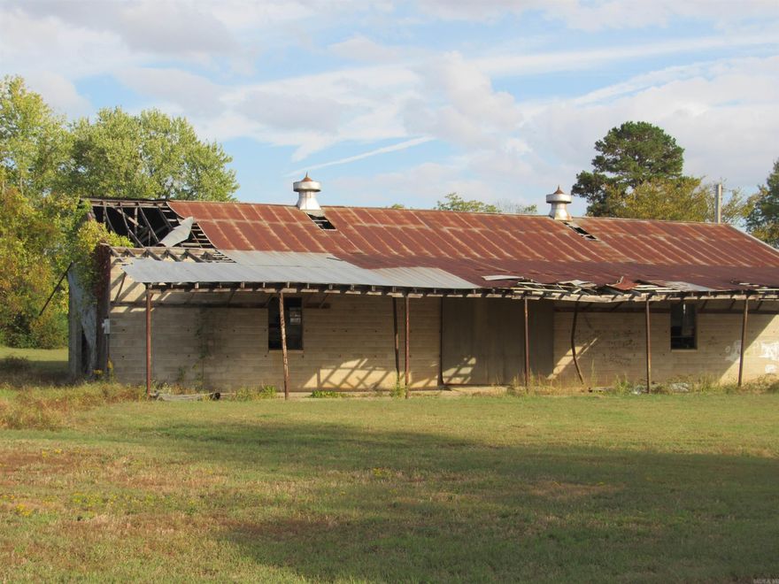 OLD STORAGE BARN SOLD IN AS-IS CONDITION.  VALUE IS IN THE ALMOST ONE ACRE OF FLAT GROUND WITH R2 ZONING FOR MULTI-FAMILY.