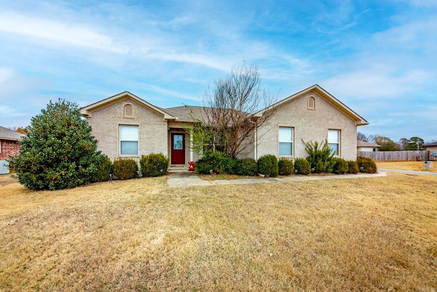 New Photos-check it out! Very nice, clean home built by Heritage Homes on a corner lot with a huge fenced back yard. Beautiful rich, laminate wood flooring in living area, tile in wet areas, and split bedroom plan. Lots of counter space in kitchen accented by tile backsplash and comes with a refrigerator! Corner lot with side loan garage and room for extra parking.  Big fenced back yard with fire pit.  Nice ceiling treatments that accent the home in dining area and living room. Tray ceiling in large primary bedroom-room for big furniture!  Seller will assist with closing costs with acceptable offer. RD financing eligible!  Seller disclosure on docsonline.