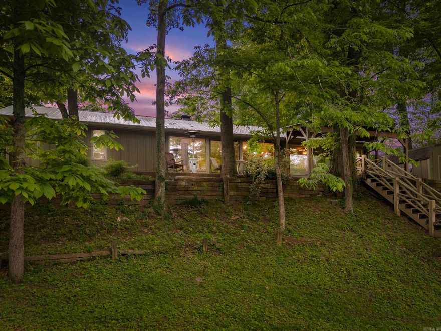 Beautiful Riverfront Oasis on the scenic Little Red River. Conveniently located in the Riverland Subdivision, just minutes from Greers Ferry Lake, downtown Heber Springs, and down the road from the Riverland Country Club and 9-Hole Golf Course.  This well-maintained 3 BR 2 BATH home features an open floor plan, oversized master bedroom with walk-in closet, cozy wood-burning stove with brick accent feature, and large windows that highlight the gorgeous river views.  Enjoy your morning coffee on the large covered patio right before you step down to your private covered dock to take advantage of the world-class trout fishing.  Updates include new covered dock and stairway (2021), metal roof (2022), new siding (2023), blacktop driveway (2020), wood patio cover (2023), fiber optic internet line installed underground (2025), and newly remodeled walk-in shower in the hall bathroom (2024). 10x12 wooden storage shed with electricity to keep all your fishing gear and lawn equipment.  This home is a gem. Schedule your showing today!