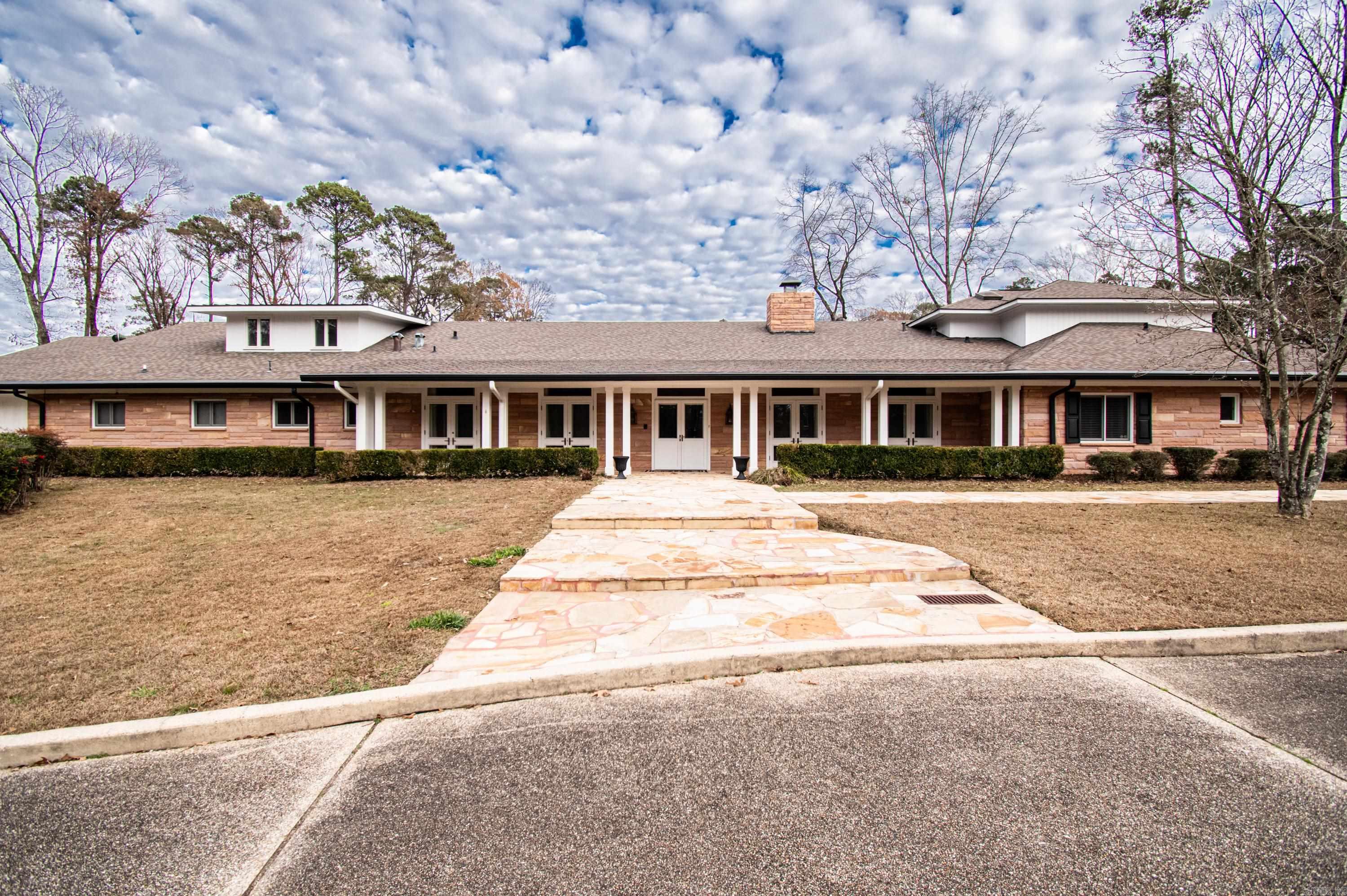 Step into luxury with this one of a kind custom home located on over 20 beautiful acres inside El Dorado city limits. This exclusive property offers many exterior amenities such as a secure gated entrance, rolling hills landscape, a bonus space for entertaining, a new Generac generator, a caretaker's home, and a pond. There is also a gated yard for small children or pets. Inside the home, you will find 7 large bedrooms, 5 full bathrooms, and 3 half baths. There are custom features throughout the home - including a bonus workout room, maintenance room, and butler's pantry with custom shelving. This home offers a large 3 car garage with additional storage. Your guests will feel at home in the 2 bedroom, 1 bath guest home with large, enclosed glass patio. Built for entertaining - this property has an expansive family room with a vaulted ceiling, a large formal living room and dining room, and a chef's custom kitchen with ample storage and custom features. This beautiful property could be your forever home!