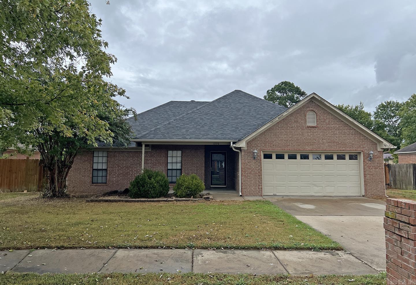 3 bed/2 bath home located within walking distance to elementary and middle school. Minutes from 1-40, shopping, and dining this house is adorable! Large living room offers gas log fireplace and vaulted ceilings. Spacious kitchen has tons of cabinets, counter space, & stainless steel appliances. There is a bonus area off of the kitchen that can be used for a dining room, office, or an additional living room! Split floor plan with primary bedroom featuring a tray ceiling, large bathroom with two walk in closets, tub, and walk in shower. Other two bedrooms are close to kitchen with a full bath on same side. Extra large laundry room is great for a craft area or storage. Fully fenced back yard with large concrete patio. Two car garage with additional attic space in garage.