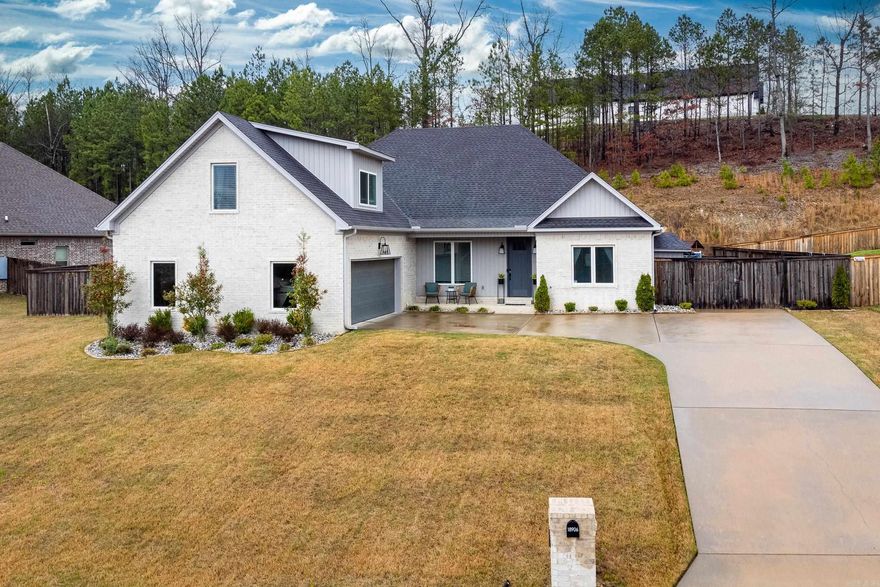 Located in a gated community just minutes from everything, this stunning property has many luxurious and custom details that elevate it above the rest. Built in 2018, this home has been meticulously maintained. As you step inside, you're greeted by tall ceilings that create a great sense of spaciousness. The open concept layout connects the living, dining, and gourmet kitchen. making it perfect for both entertaining and everyday living. The elegant wood flooring adds warmth and character to the space, while the adjustable LED lighting and home music system throughout allows you to create the perfect ambiance for any occasion. For added convenience and security, this home also includes a custom hidden safe, perfect for storing your valuables. The heated and cooled garage gives you utility year-round, offering plenty of space for parking, storage or projects! There's even an extended parking pad behind the fence for a 4-wheeler, trailer or boat. Enjoy mornings sipping your coffee on the covered back porch in your private setting backyard that backs up to greenspace. AGENT SEE REMARKS!!!