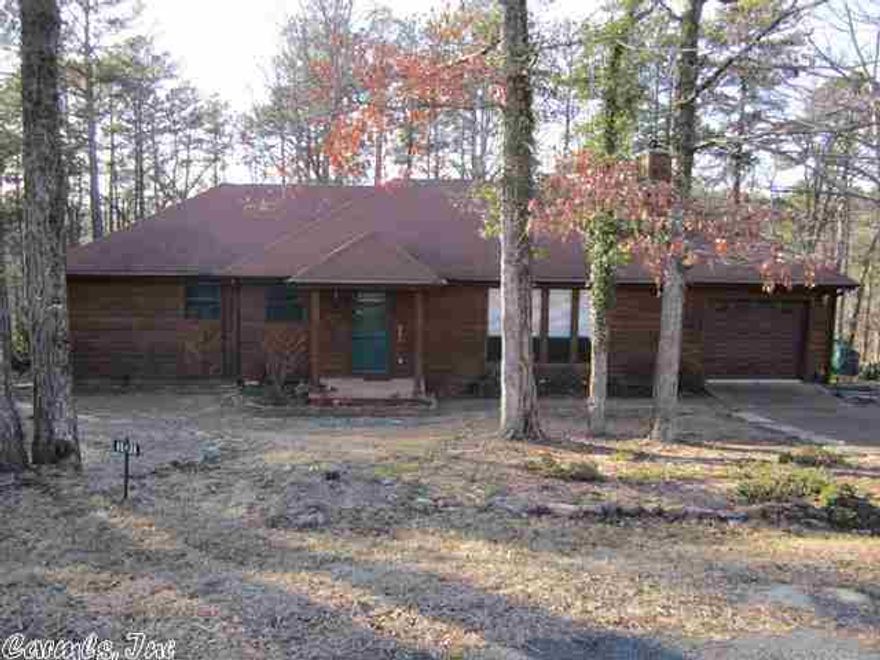 A rare find.  This home with cedar siding in sits on the corner with an extra lot for added yard space.  Drive your golf cart to the Pro Shop.  Castle Ridge is an excellent subdivision around the Indian Hills Golf Course and has underground utilities.  You will like this comfortable two bedroom home with a 3 season sun room which could easily be converted into an extra year round living space.  Enjoy the natural surroundings from the sun room that overlooks the wooded valley below.