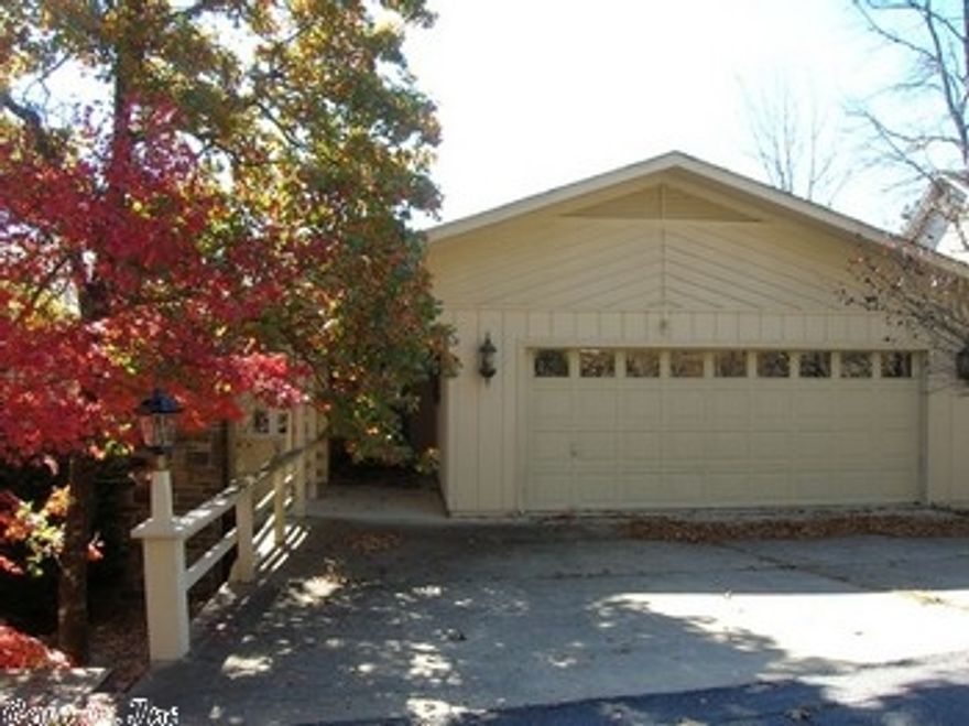 Super nice view!!  3 bed/2 ba/with large sunroom and 2 car garage, formal dining area, built-ins.  This home has been well taken care of, but needs some updates. Private deck with Pergola.  Workshop area in crawl. Wood burning fireplace and the firewood on the property conveys. Level Driveway.  Being sold as is. HMS Warranty in effect. Priced to sell!