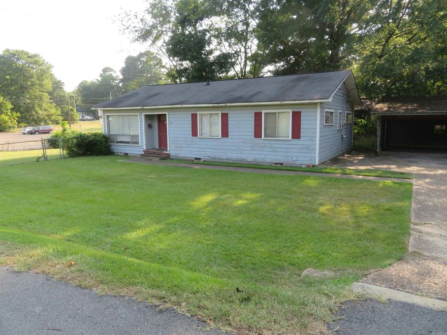 Zoned C-2 (Highway Commercial).  'Older', frame siding residential structure measuring approx. 1,326 SQ. FT., centrally heated/cooled.  Overall exterior dimensions of the present building is approx. 30' depth x 45' width, less a recessed, 'covered', exterior entry alcove.  The adjacent, double carport (22' x 24') is detached --- but, is located immediately beside the main structure. SPACIOUS interior!  5 Rooms plus a large hall bath and a private half-bath shared by two of the original bedrooms.  The floor plan is perfect for a private office building remodel:  Large living/dining combination with front entry offset, a big kitchen with rear entrance door, an extra-wide hallway to the original bedrooms, 3 separate bedrooms (private offices), and 1.5 bathrooms. NEW central heat/air in August of 2021 (gas heat/electric air) 'York' package unit. 3-Tab shingles NEW, September of 2012, installed by Brian Bridges. NEW refrigerator/freezer, 'Sears' Kenmore, March 2020. AWESOME LOCATION on Pine Street for a privately-owned business!  Priced to sell at $84,500.  Immediate possession available upon 'Closing'.