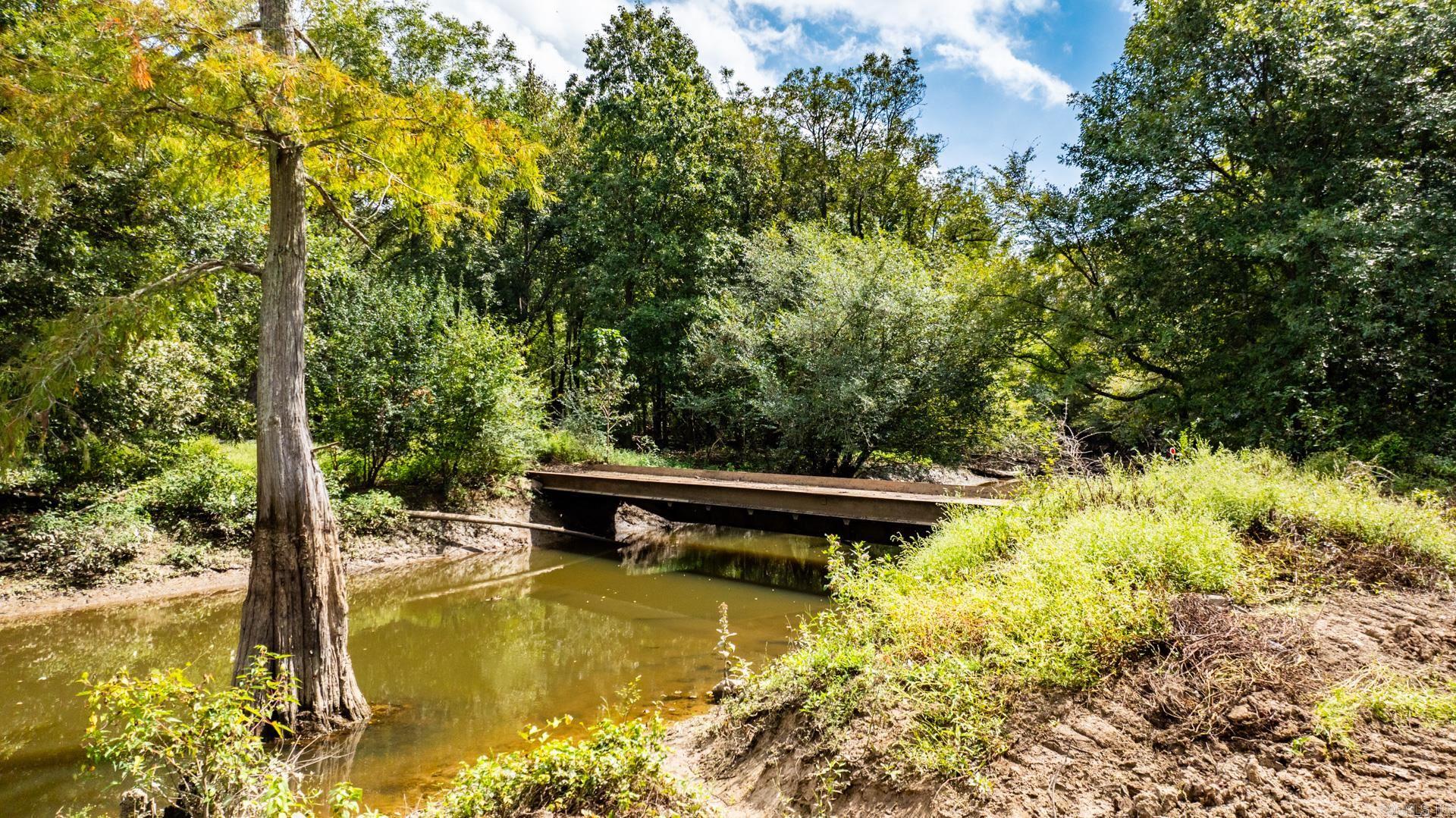 This 246-acre hunting paradise in Lonoke County, Arkansas, is perfect for outdoor enthusiasts and serious hunters. Bordered by the Prairie Bayou Wildlife Management Area on its eastern side and traversed by Two Prairie Bayou, this property is a prime location for deer and premier duck hunting. Expertly developed with boat lanes, steel bridges, and water control gates, itās designed to enhance both hunting and habitat management. With 82 acres on the east side that can be flooded, a 44-acre southwest quadrant, and a new 33-acre flood area with a new pipe added this year, the property boasts 115 acres of manually retained flood water and about 50 acres naturally flooded, with the rest reserved for deer and high ground. Conveniently located just south of Carlisle, it's only 47 minutes from Little Rock and 1 hour and 48 minutes from Memphis.