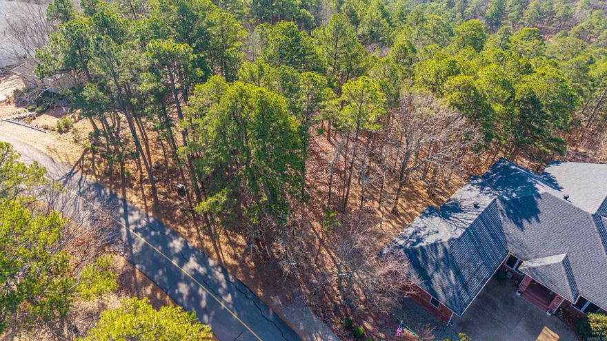 Rare opportunity to build in beautiful Hot Springs Village—a golfer’s dream setting with mature trees and a natural homesite that welcomes creative design and easy construction. Centrally positioned inside the nation’s largest gated golf community, this lot offers both privacy and lifestyle appeal.  Hot Springs Village community perks include 9 total golf courses, 11 recreational lakes with marinas and beaches, 30+ miles of hiking/biking trails, indoor and outdoor pools, Coronado Fitness Center, dog parks, youth programs, and 24-hr gated security.  Minutes to shopping, dining, and medical. Easy access to Lake Catherine & Lake Ouachita, 20 min to historic Hot Springs Bathhouse Row.