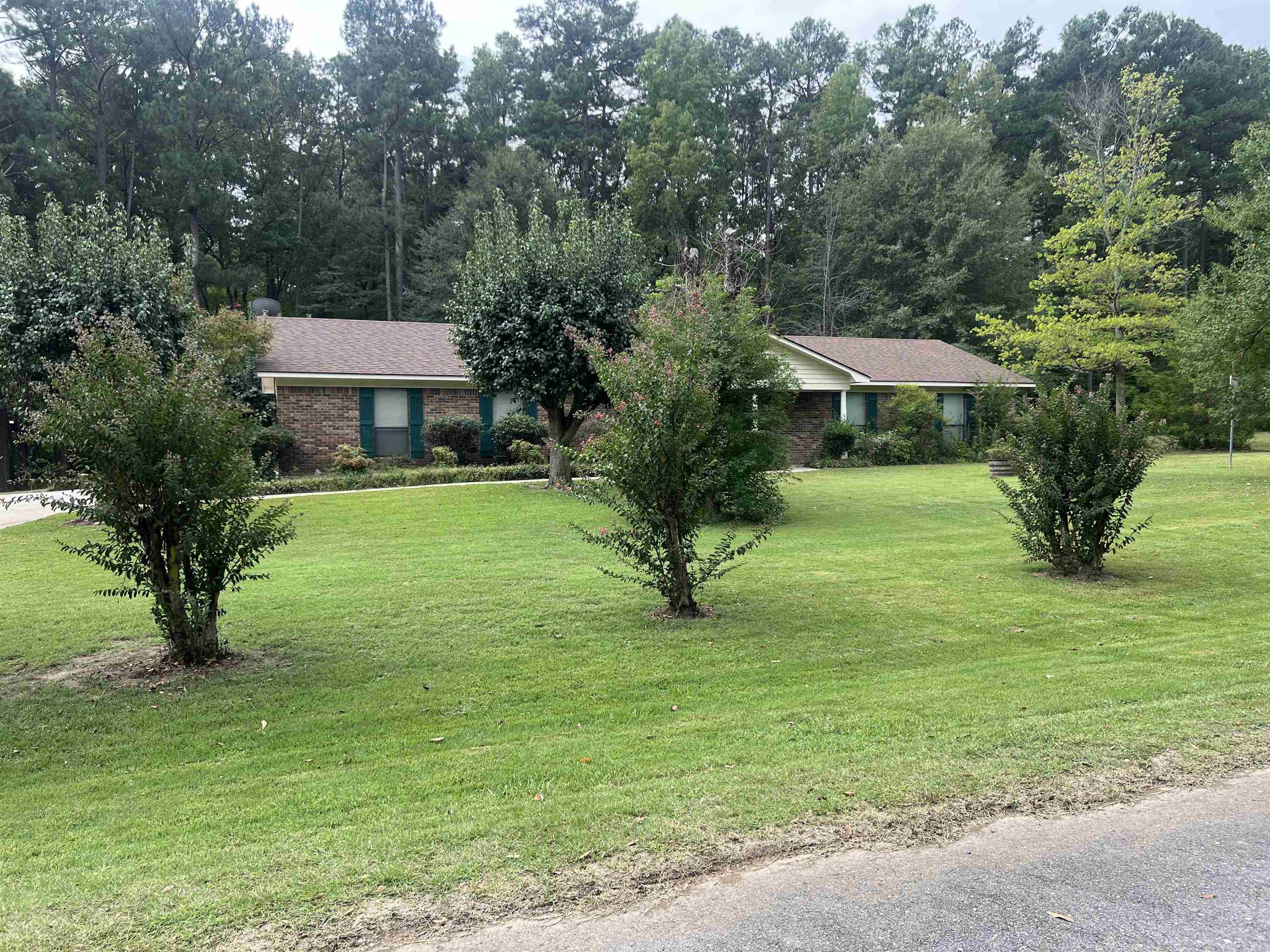 Well maintained 3 bed 2 bath home on a 1.38 acre lot. This home has a fenced in back yard, 20x22 carport one 12x18 storage building and another 16x32 storage building. The home has a gas log fireplace in the spacious living room, eat in kitchen, utility room off kitchen with built in cabinets, spacious master suite with walk in shower and large guest bedrooms. The sunporch on the back of the home is heated and cooled for your comfort.