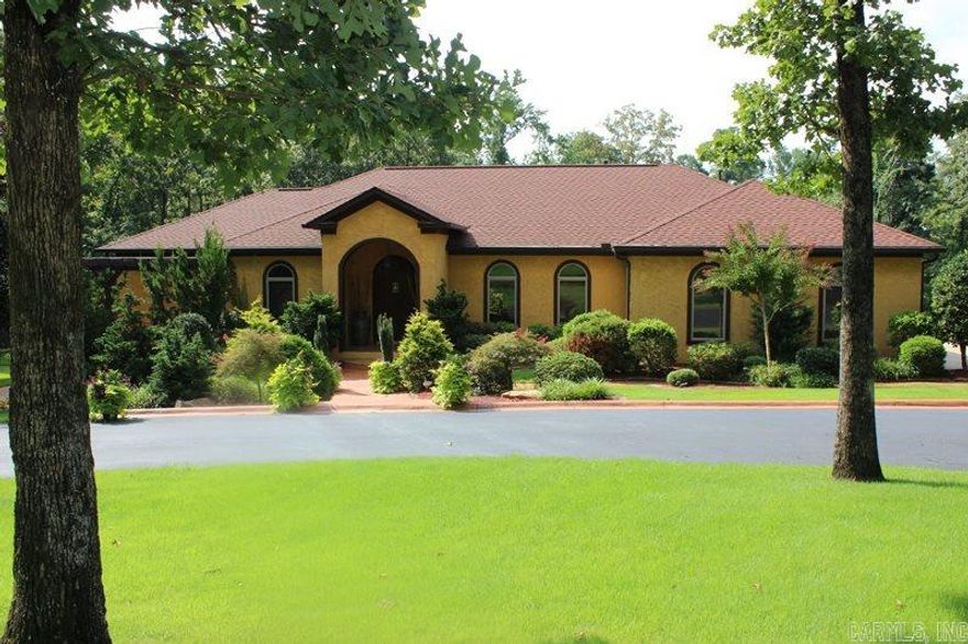 Beautiful Mediterranean Oasis on approx 5.03 acres in West Little Rock. Exterior features heated pool, hot tub, half basketball court, surround sound, basketball courts, and circle drive. Interior features open kitchen/living/dining area, media room, updated paint. New custom closet. $38,000 in stereo equipment. New hardwoods in 3 bedrooms upstairs, new light fixtures. Master bath remodeled. Two laundry rooms. Extra built-ins, wine refrigerator and ice machine in wet bar, over sized office and more!!