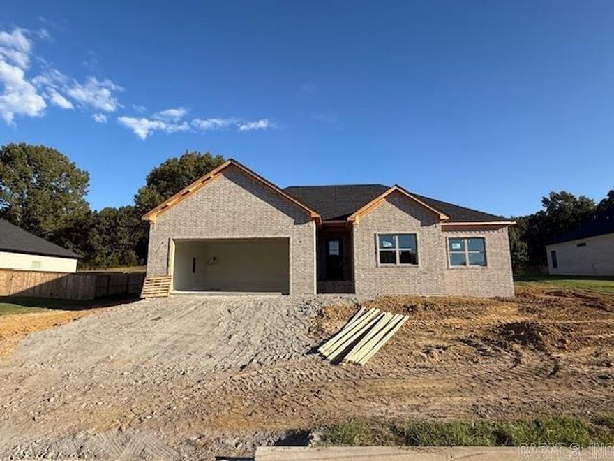 Great plan! Has a large living room with lots of windows open to the kitchen. Electric fireplace is great focal point on the wall.  Nice sized island in the kitchen with cabinetry in the island. Big pantry! Electric fireplace. Primary bedroom has box ceilings for extra height.  Guest rooms are separate from the primary bedroom. Tile showers in bathrooms. Fantastic porch across the back of the home.