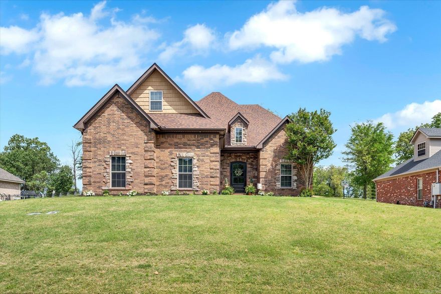 Stunning updated executive home with sunroom and screened porch sitting on the 17th fairway.