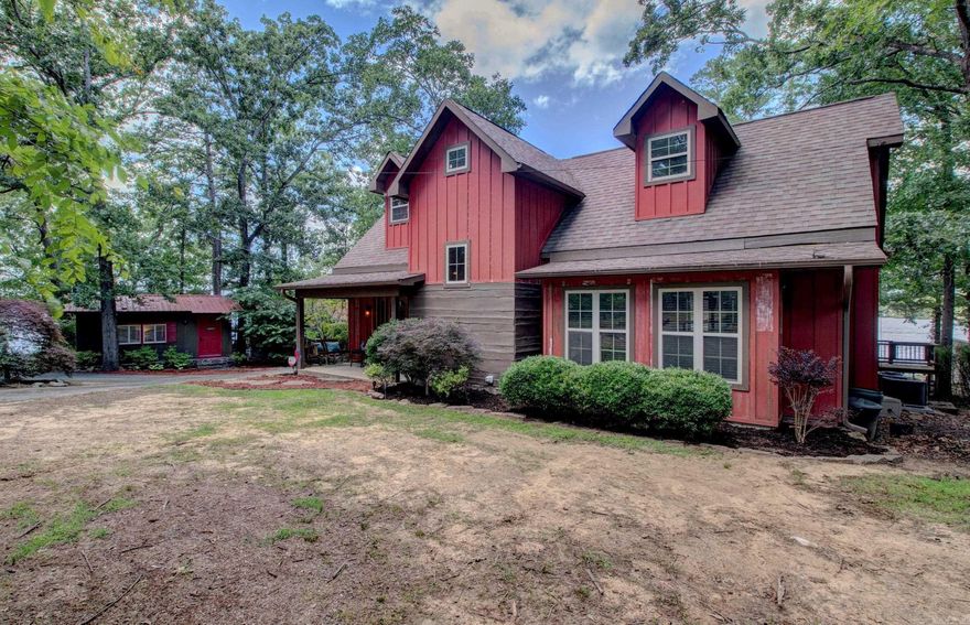 Beautiful Lakefront Home with 2 income producing guesthouses! This stunning 4 bedroom, 2-bath home offers sweeping views of Greers Ferry Lake, positioned along a low white line with its own private tram to the water. The open-concept layout features a split floor plan, a large upstairs bonus room, beautiful flooring throughout, and a wood-burning rock fireplace that adds rustic charm. The kitchen is updated with new granite countertops, stainless steel appliances, a convenient breakfast bar—perfect for entertaining. The spacious master suite boasts lake views, a walk-in closet, an ensuite bath, & direct access to a screened-in porch. Step outside to enjoy the expansive covered porch—ideal for soaking in those lake sunsets. Two additional furnished cabins currently operate as short-term rentals, generating over $26,000 income in 2025. Each cabin includes a bedroom, bathroom, and kitchenette—ready for guests or extra space for family. Both completely remodeled in 2020 & 2021 Whether you’re looking for a private retreat, income property, or both—this is lake living at its best! Call or message me today for a private viewing Square feet includes two cabins.