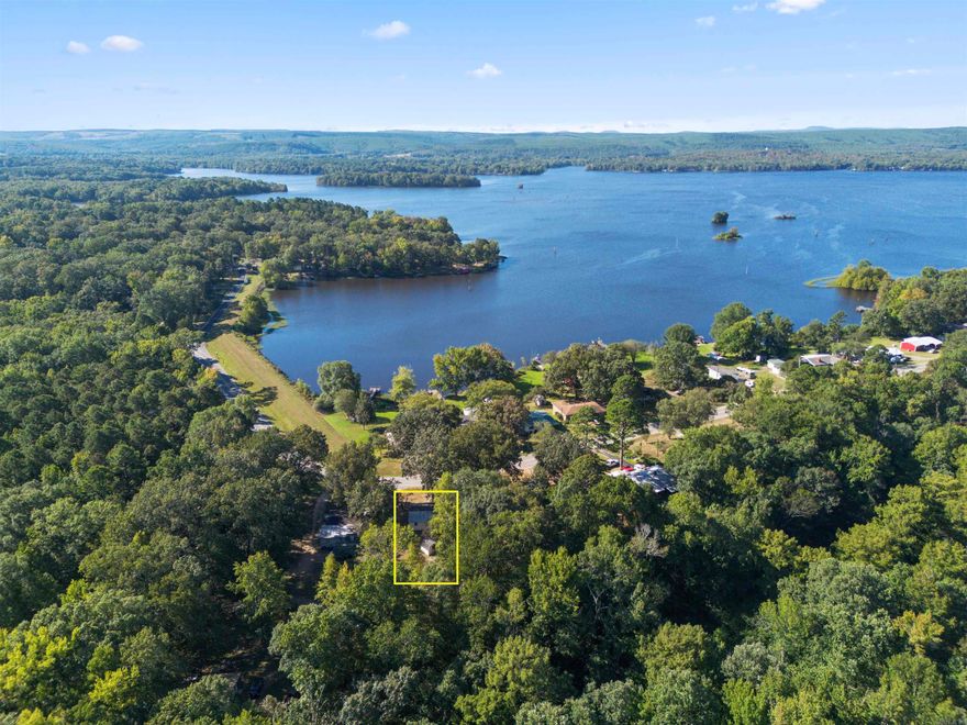 This lake view cottage sits across from Harris Brake Lake! It features 2 bedrooms and 1 bathroom. Harris Brake Lake is the 3rd largest lake owned by the Arkansas Game and Fish Commission. Enjoy everything lake living has to offer, while being close to the Ouachita National Forest! Centrally located between Conway, Little Rock and Russellville. Fiber internet is available here! Home needs some TLC! Stove,  refrigerator and storage buildings will convey! This property is located between 2 Harris Brake Lake Boat Ramps - Chitman Hill Landing & Harris Brake Dam Boat Landing.