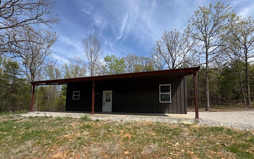 This 8.75-acre estate offers a premier, turnkey homestead with all-new 2025 infrastructure. The centerpiece is a 1,200 sq. ft. (30x40) red iron shop, fully spray-foamed and climate-controlled via a large mini-split. This versatile space includes sealed and waxed concrete floors, a full kitchen and bathroom, laundry hookups, and a 30x12 covered porch, with framing already in place for a future 12x10 garage door. The land features cleared, seeded pastures fenced on two sides, a wet-weather creek, and established ATV trails. Development is made easy with a 400-amp service split for the shop and a future home, NEXT high-speed internet, and a septic system sized for a 3–4 bedroom house. All utilities, including water and internet conduit, are buried to preserve the scenic views. With a driveway in place and water lines already run to the pasture for a future barn or garden, every detail of this property has been meticulously handled to ensure a seamless transition to a country lifestyle.