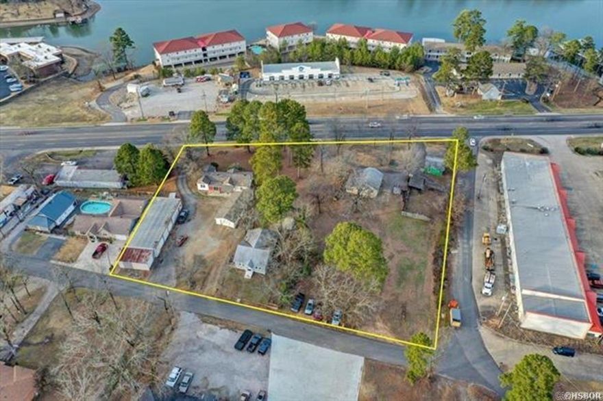 Two occupied homes on the property. One is 3/2, 1395 SF, built in 1958 (1369 Airport Rd) Second is 2/1, 1131 SF, built in 1942 (108Lancaster) However the main value is in the land for commercial development. located just over the 70W bridge. Highly visible with approx. 338ft.+/- of HWY 70W frontage. Surrounded by 3 roads for optimal ingress/egress. Survey on file, 3 parcels total 1.92 acre MOL. Property includes 5 structures (3 homes, small shop, metal building) each with electric, city water, and septic. City sewer is available on Lancaster. 2021 ARDOT Traffic Count of 35,000 cars per day. Convenient to restaurants, shopping, and all Hot Springs has to offer. Being approx. 1 mile from the bypass, there are a plethora of business opportunities awaiting you!