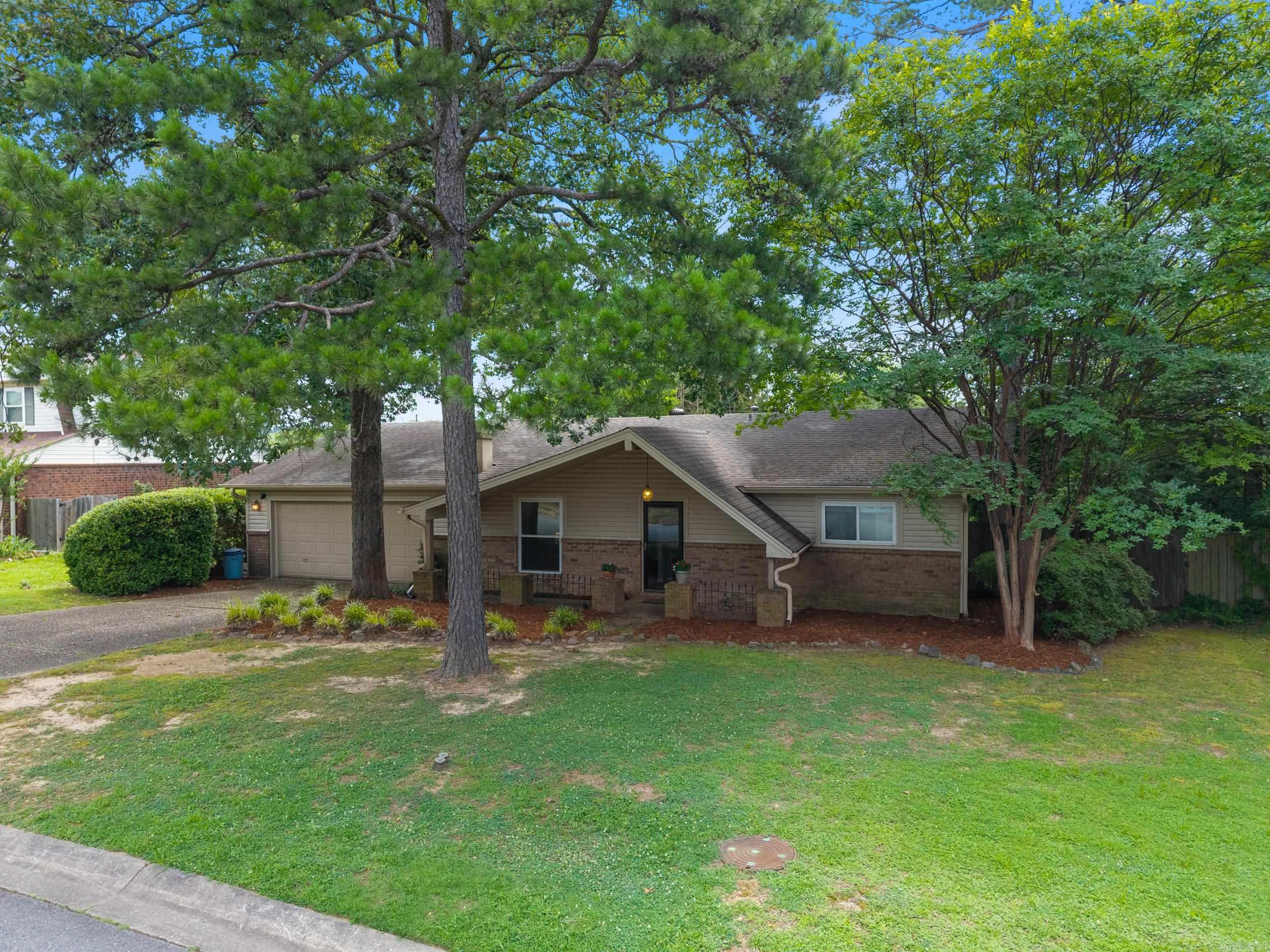 Welcome to 3921 Sierra Forest, nestled in the heart of West Little Rock. This thoughtfully laid-out three bedroom, two-bath home offers, space and convenience just minutes from the Pleasant Ridge Shopping Center, dining and other family-friendly amenities. Inside, you'll love the oversized living room with a large front window that brings in tons of natural light and gives you a great view of the yard. Equipped with a home generator, the home has been freshly painted, giving it a crisp, updated feel from the moment you walk in. The kitchen includes a cozy eat-in area and flows easily into the main living space, making it perfect for everyday living or entertaining. The primary bedroom features a large closet and an en-suite bathroom. The other two bedrooms share a full hall bath. The fully fenced back yard is perfect for kids and pets and offers plenty of privacy, along with a spacious covered patio perfect for entertaining and relaxing. This is a great opportunity to live in one of West Little Rock's most convenient neighborhoods.