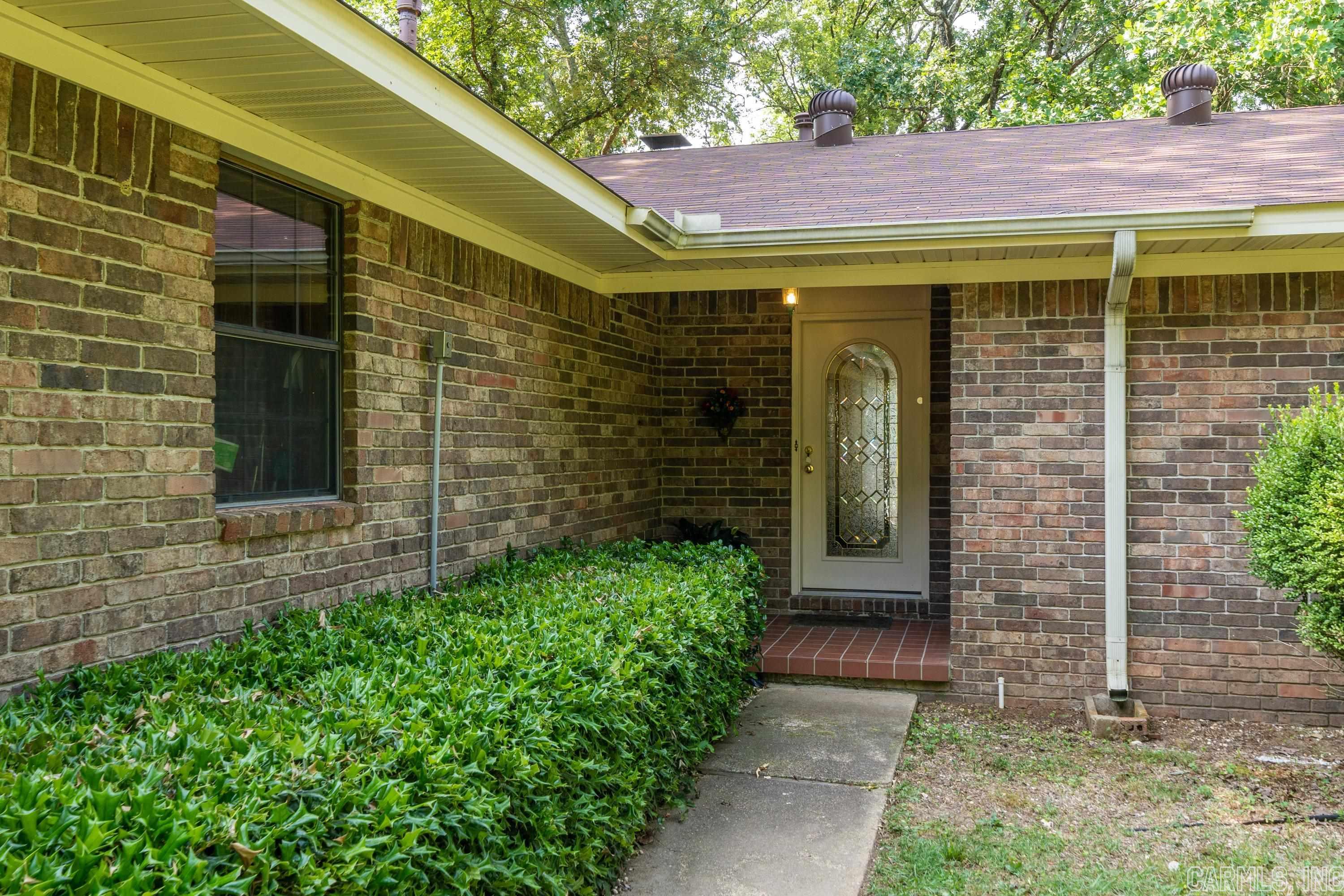 Lake life is calling!!! Must see this three bedroom/three bath lakefront home on Lake Hamilton with a boat dock! Located close to restaurants and shopping! Nice level lot with lots of trees! Bring you beach towels and sunscreen, this one won't last long!