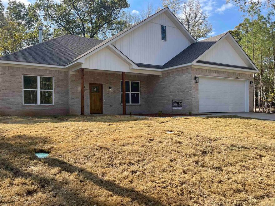 Beautiful, new construction 4 bedroom 2 bath home located in Diamondhead Subdivision. Split floor plan with beautiful custom cabinetry throughout. Luxury lighting, fireplace, vinyl plank flooring and granite countertops. Custom shower in primary bath. Large wooded lot. You don't want to miss this one!