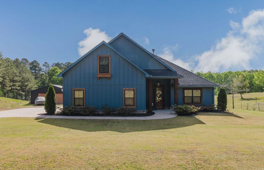 Welcome to your private retreat on 2.39 acres! This beautifully built 3-bedroom, 2-bath home (constructed in 2020) also features a spacious upstairs bonus room which is perfect for a fourth bedroom, office, or entertainment space. Designed with a split floor plan for added privacy, the home offers an open-concept layout filled with natural light. The spacious primary suite includes a walk-in shower for a touch of everyday luxury. Enjoy peaceful country living with convenient access to Hot Springs, Benton, and Little Rock—ideal for commuters seeking both privacy and accessibility. Step outside to a covered back deck overlooking wooded acreage, complete with a garden space featuring a rainwater irrigation system, a small vineyard, and an abundance of fruit trees.The 30x40 shop provides plenty of room for hobbies, storage, or projects. Inside, the wood-burning fireplace with floor-to-ceiling brick creates a warm, inviting atmosphere—perfect for cozy evenings while taking in serene views of your private surroundings. The kitchen features a large island, plenty of cabinets for storage and open concept directly into the natural light filled dinning area, perfect for family get togethers