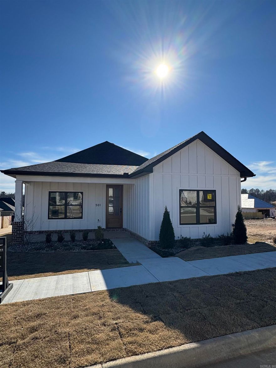 Discover this stunning Craftsman-style home nestled in Bryant's most desirable neighborhood! Boasting custom designer finishes throughout, this residence offers a blend of elegance and practicality. Its prime location provides the convenience of a short stroll to the neighborhood pool.  Imagine relaxing on the welcoming front porch and enjoying the nearby weekend farmers market. The home's thoughtfully designed layout features an open kitchen and living room, bathed in abundant natural light. Back Patio. Completion is Estimated for December. Come see it today!