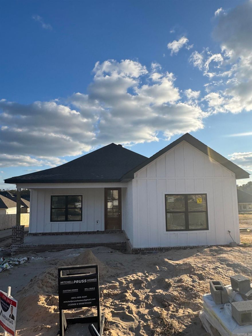 Discover this stunning Craftsman-style home nestled in Bryant's most desirable neighborhood! Boasting custom designer finishes throughout, this residence offers a blend of elegance and practicality. Its prime location provides the convenience of a short stroll to the neighborhood pool.  Imagine relaxing on the welcoming front porch and enjoying the nearby weekend farmers market. The home's thoughtfully designed layout features an open kitchen and living room, bathed in abundant natural light. Back Patio. Completion is Estimated for December. Come see it today!