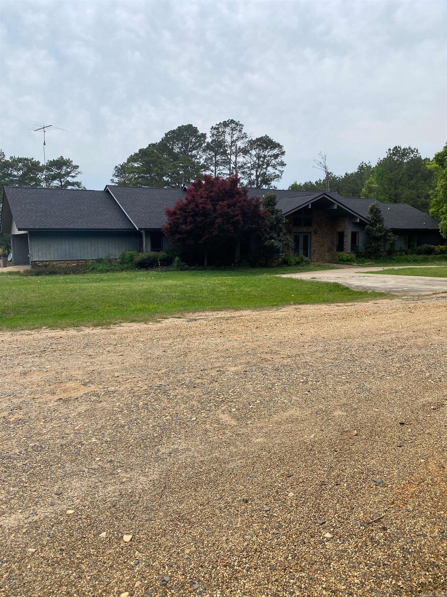 Beautiful country setting in Stephens. 10+ acres with outbuildings and pond.Home to be sold As-Is.