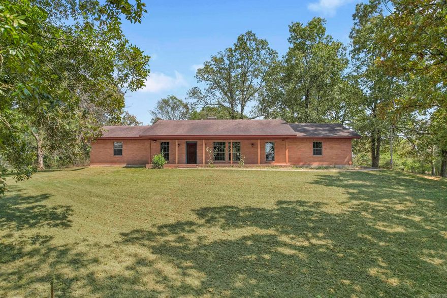 This beautiful ranch style home has it all for the family that loves to live in the county! There is 1920 square feet and has 3 bedrooms, 2 bathroom, formal dinning, eat in kitchen, living room, den, and laundry room sitting on 38.1+/- acres! No close neighbors! Sit on the front porch and enjoy viewing the pond below.  Look for the picture of the fish over the fireplace they were caught in the pond.  So yes there are fish in the pond!  This property is mostly cleared and fenced with a gate at the entrance. The gate is visible from the home.  A 1000 gallon butane tank that is used for your hot water and heating in the winter comes with the property.  This little piece of heaven even has a 300 foot well that contains "soft' water. This home was built with 2x6's and appears to be well insulated.  Most of the home has brand new flooring and new paint inside and outside  Front and back porch posts are new. So bring the family, the dogs, the cows, and the horses.  There is room for all.  Plus there are 3 friendly guineas waiting for supper! Also there are several deer and other wildlife! Homes with land like this do not come around very often.  Do not let this one get away!!