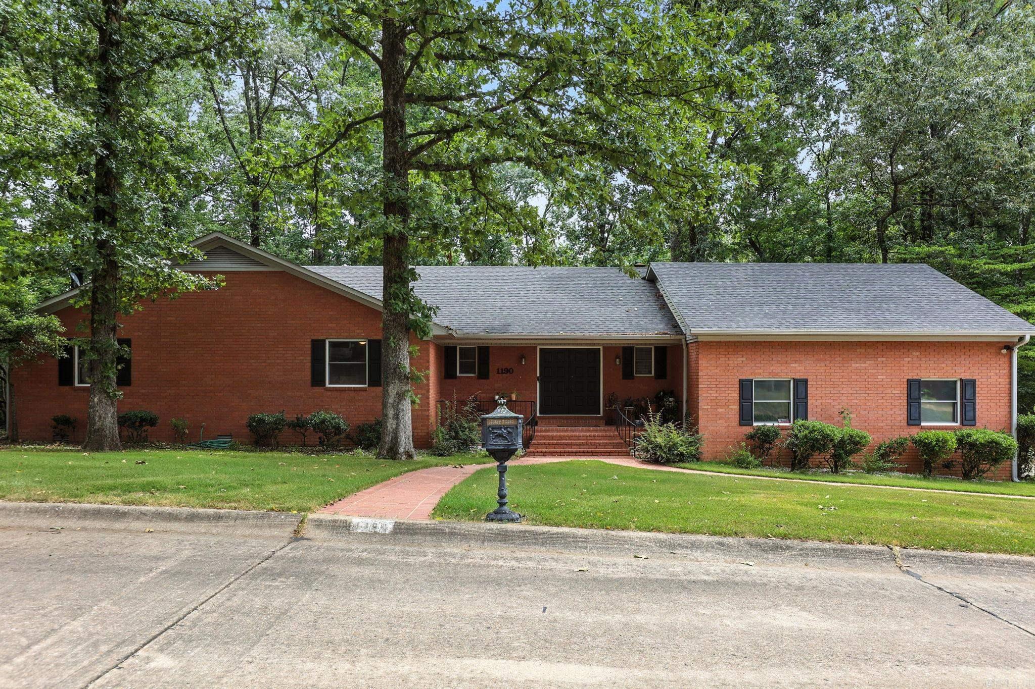 This one has what is on everyone's wish list!! Whole house generator. Very large kitchen with TONS of cabinets. Double ovens. Gas cooktop. Wood floors throughout. Large living room with gas log fireplace. Wet bar in living room. Oversized bedrooms. The master bedroom is HUGE! Lots of built ins for plenty of storage. Double closets. Master bath boasts garden tub, separate shower, double sinks. New toilets in all bathrooms. New roof 2022. Storage under house. Extra storage room in 2 car garage. Gutters. Private backyard. Fully fenced. This one just feels like home as soon as you walk through the door! Very convenient location in Benton. Don't miss this one!