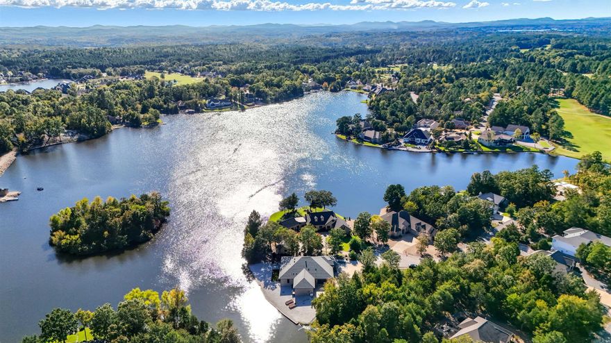 Modern lakefront luxury built in 2022. This 3,292 sq. ft. home offers 4 spacious bedrooms and 4.5 baths, plus a media room, all designed for comfort and style. The chef’s kitchen features a full suite of Viking appliances, while the open living spaces showcase lake views that steal the show. The primary bedroom has his and her closets spacious bath and a gorgeous view! Step outside to 178 feet of pristine seawall—perfect for quiet mornings or sunset evenings by the water. Two 2-car garages provide ample space for vehicles and lake toys, plus a safe room and buried propane tank with whole-house generator ensure peace of mind year-round.  Every detail is top-tier—modern design, thoughtful layout, and unbeatable lakefront living on Lake Sophia.